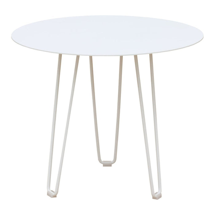 Round white table with sleek white legs, featuring a minimalist design and smooth surface perfect for modern decor.