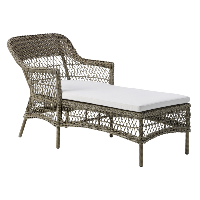 Light grey wicker lounge chair with a white cushion, featuring a woven texture and elegant curves. 