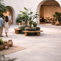 Neutral tones with green plants and wood accents in a modern, minimalistic indoor space.