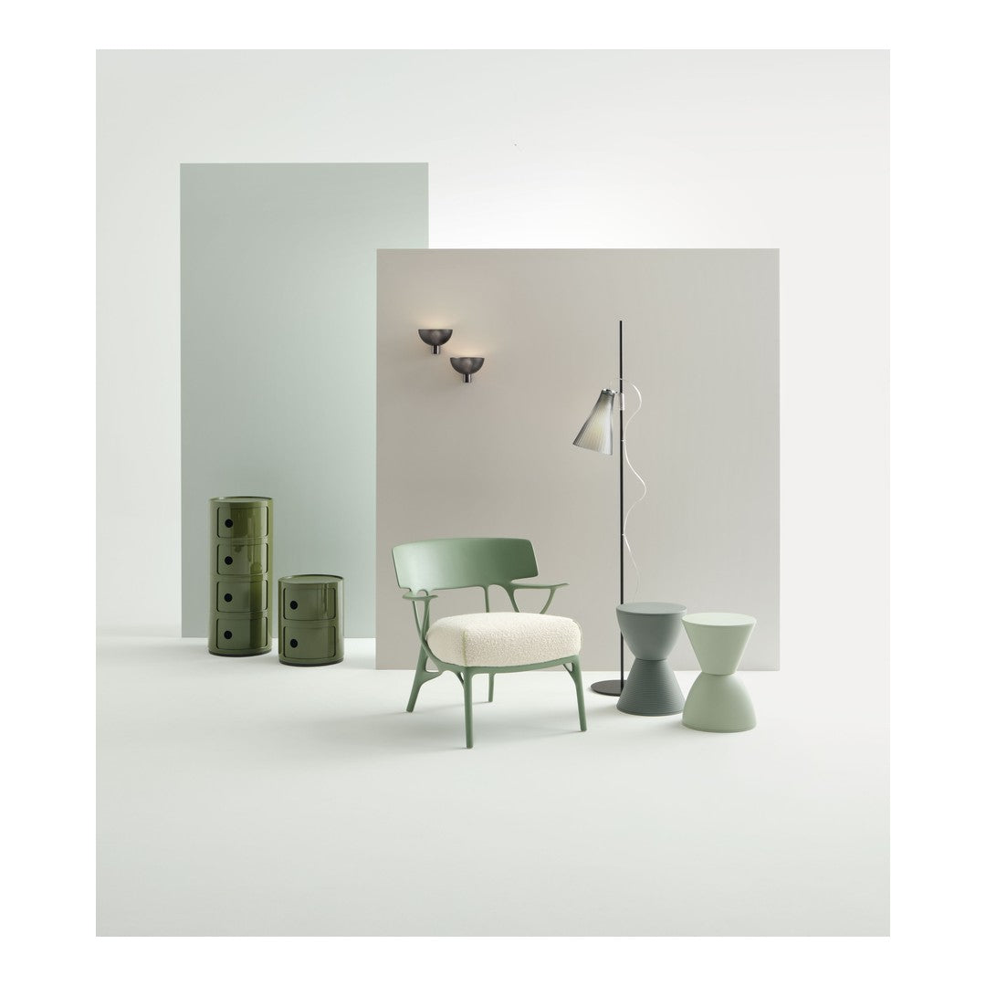 Green and gray furniture set against soft pastel backgrounds, showcasing modern design and subtle patterns.