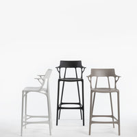 Stylish bar stools in matte white, black, and taupe with modern, sleek designs and unique cutout patterns.