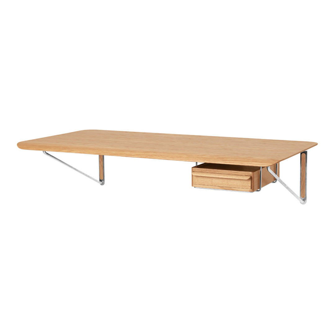 Natural wood desk with a smooth oak finish and minimalist design, featuring a subtle drawer and sleek metal supports.