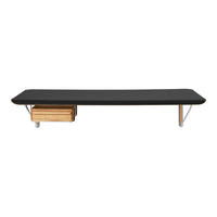 Sleek black tabletop with natural wood drawer and metallic legs, featuring a minimalist design for modern decor.