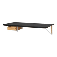 Modern black tabletop with natural wood drawer and sleek metal legs, perfect for contemporary interiors.