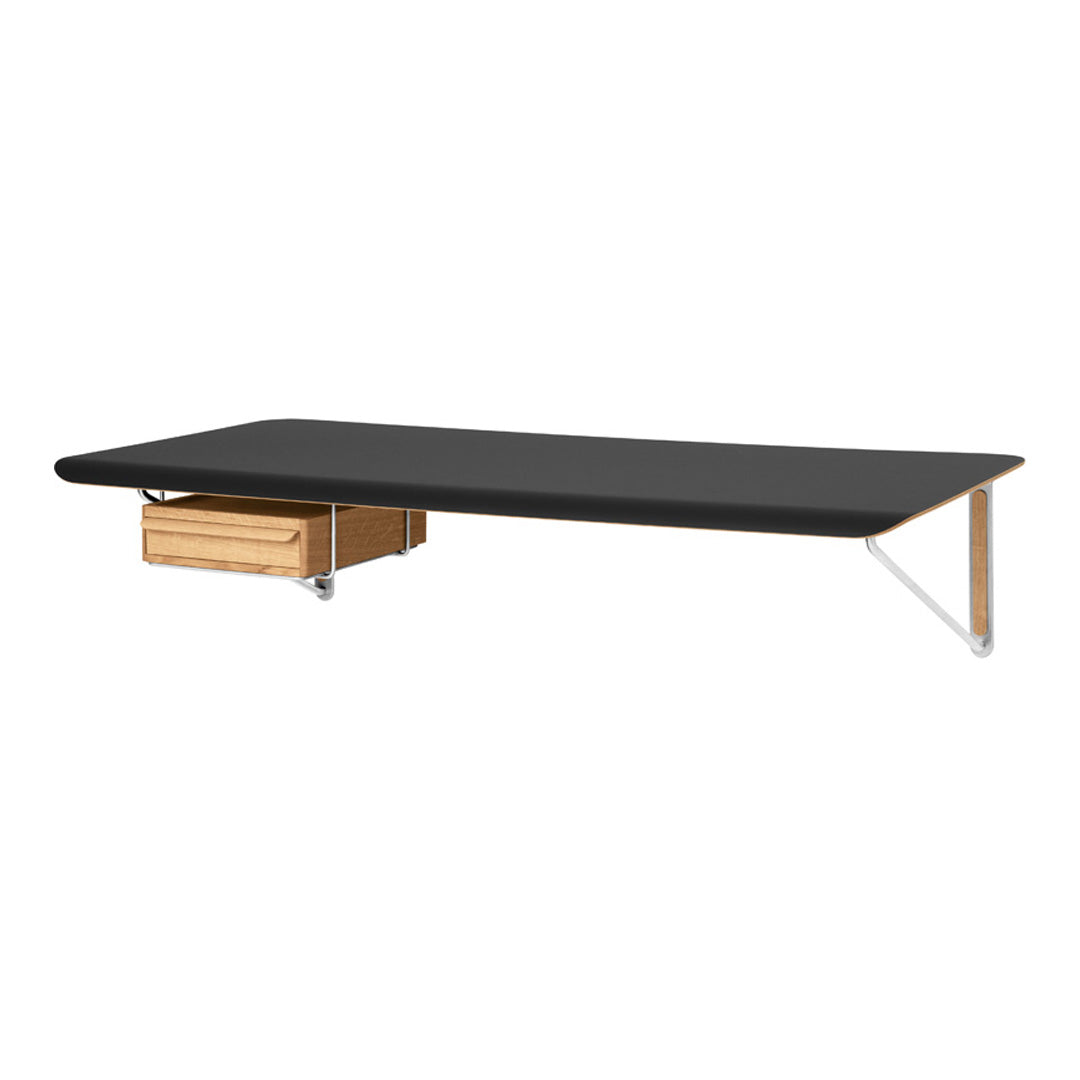 Black tabletop with a smooth finish and natural wood drawer, featuring sleek metal legs for a modern look.