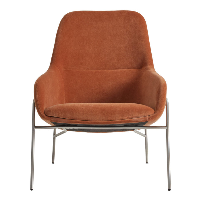Rust-colored velvet armchair with smooth, modern lines and sleek metal legs. Perfect blend of comfort and style.