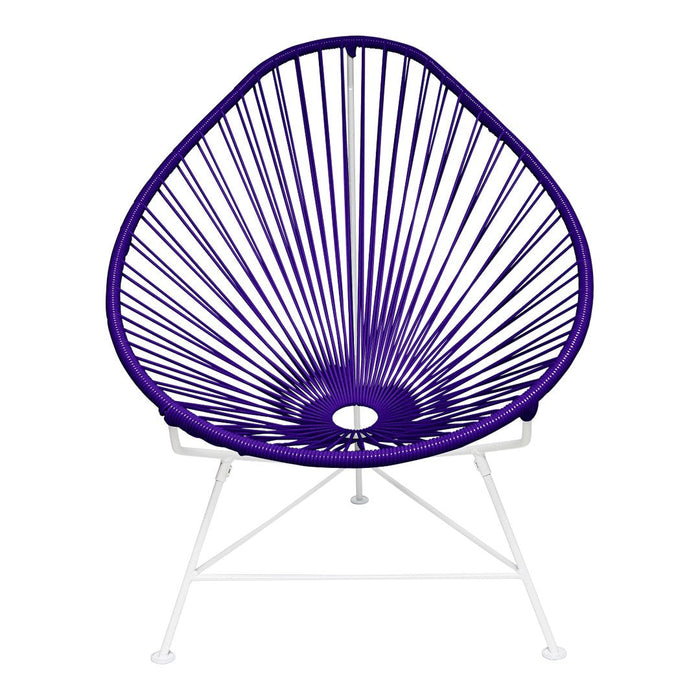 Purple Acapulco chair with a geometric pattern and white metal legs, perfect for modern decor.