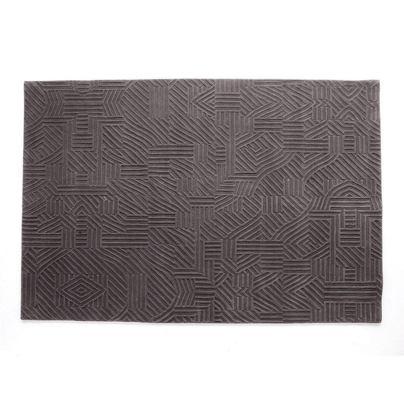 Dark gray rectangular rug featuring a modern, geometric pattern with textured lines. Perfect for contemporary decor.