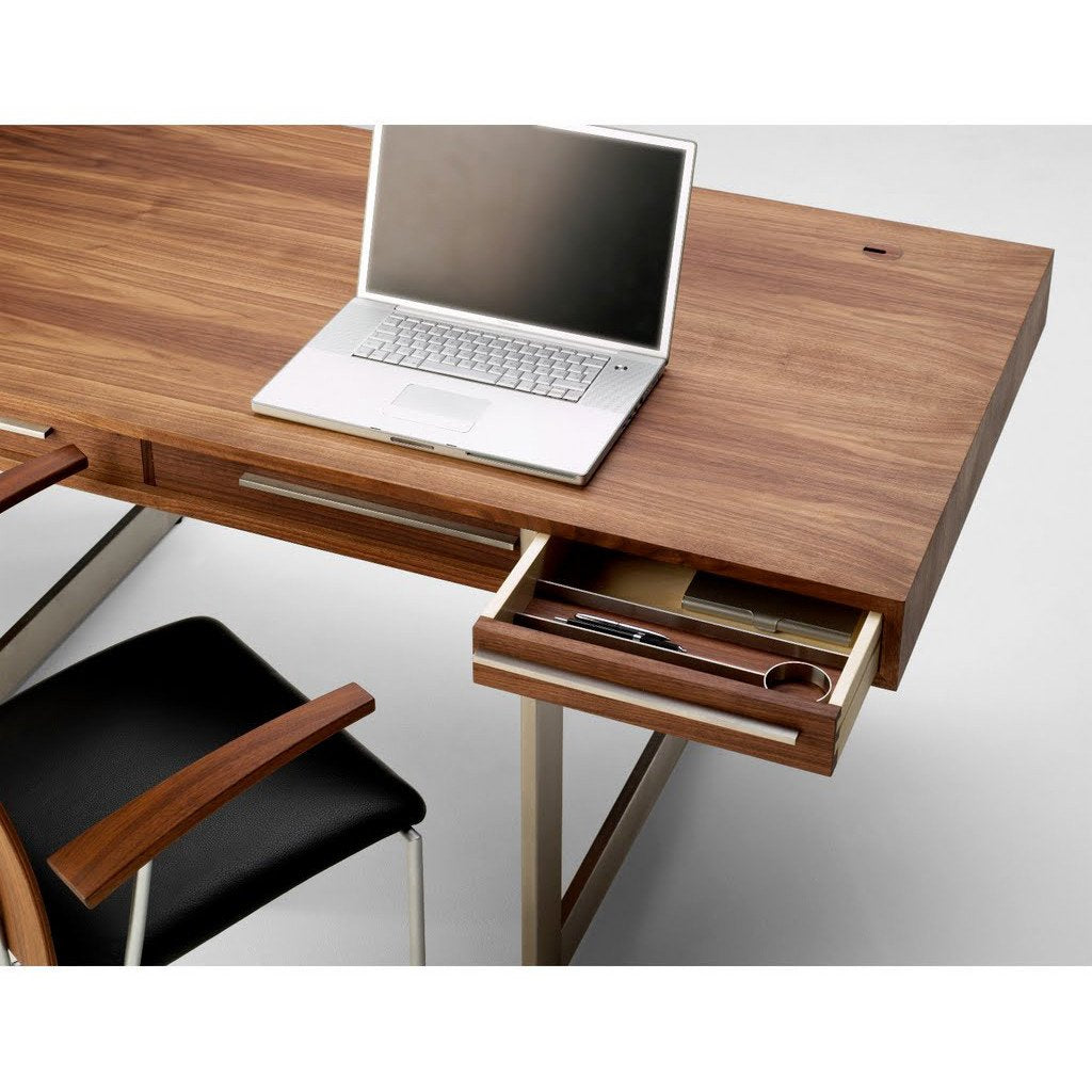 "Contemporary wooden desk with rich walnut finish and sleek silver hardware, featuring a minimalist design."