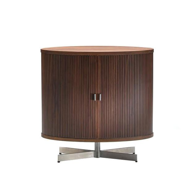 Brown wood cabinet with vertical ribbed pattern and sleek silver base. Modern design adds elegance to any space.