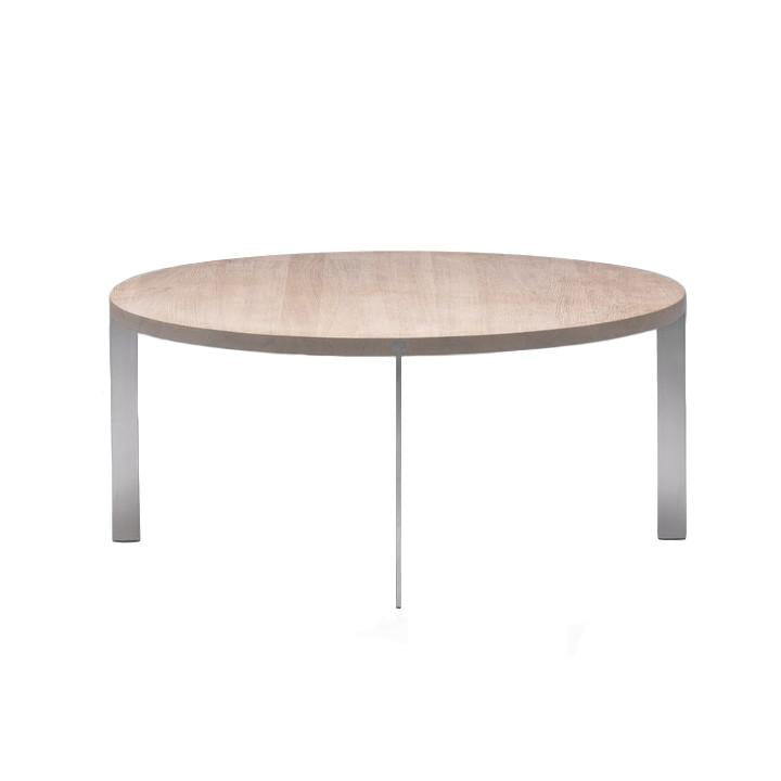 Round coffee table with a light wood top and sleek silver metal legs, showcasing a minimalist design.