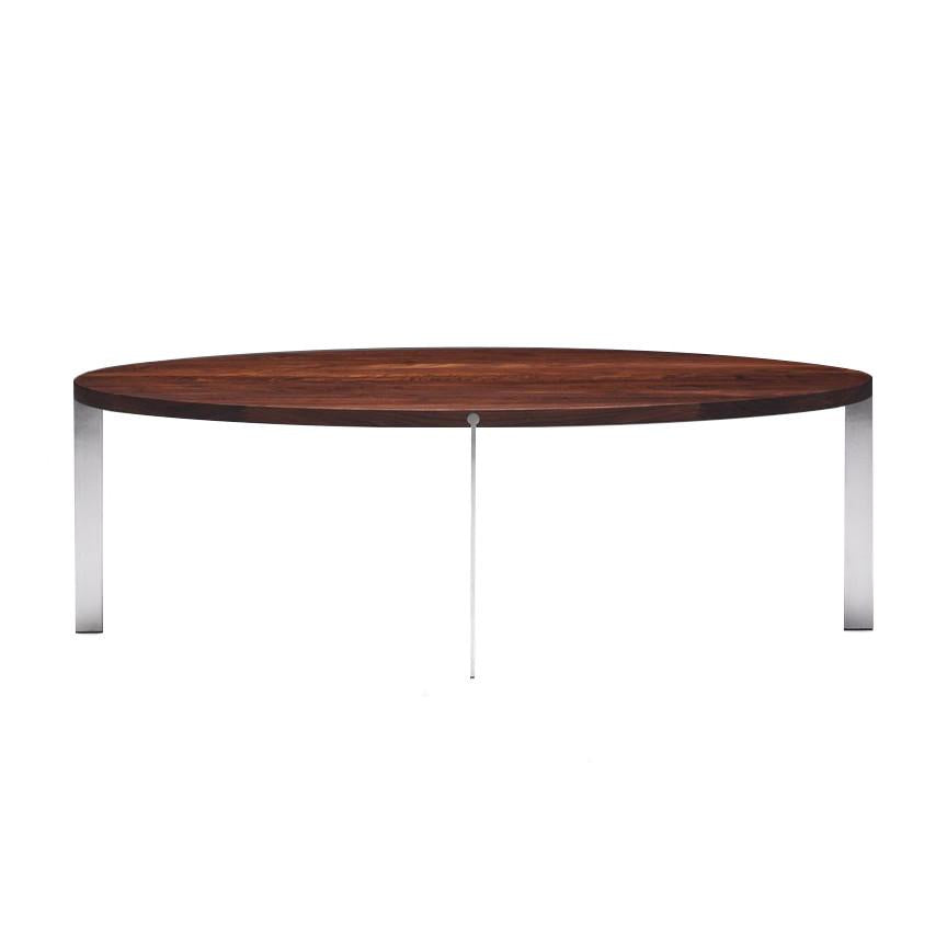 Round wooden coffee table with a dark walnut finish and sleek chrome legs, showcasing a modern, minimalist design.