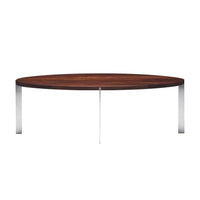 Round wooden coffee table with a dark walnut finish and sleek chrome legs, showcasing a modern, minimalist design.