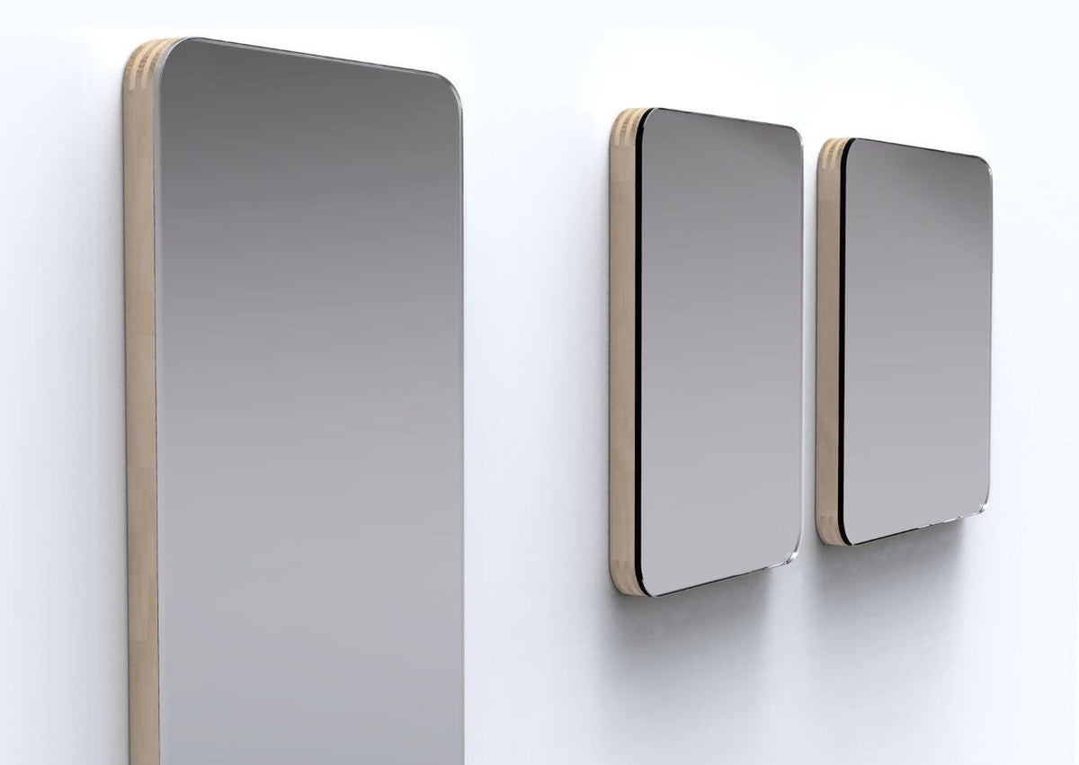 Set of three modern gray mirrors with a sleek wooden frame, featuring smooth, reflective surfaces against a white wall.