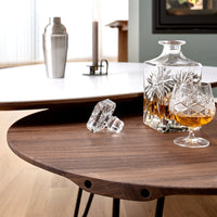 Elegant wood and white composite coffee table with smooth curves and rustic wood tones. Perfect for modern interiors.