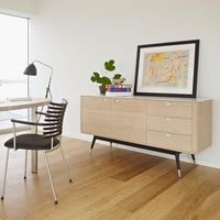 Light wood sideboard with minimalist design, featuring a smooth finish, sleek lines, and subtle metallic accents.
