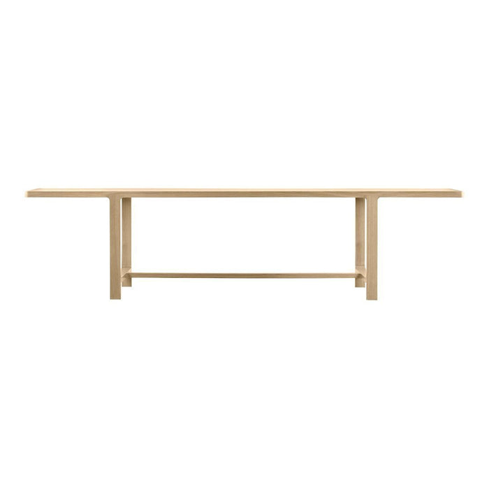 Light natural wood dining table with a sleek, minimalist design and smooth, uniform surface.