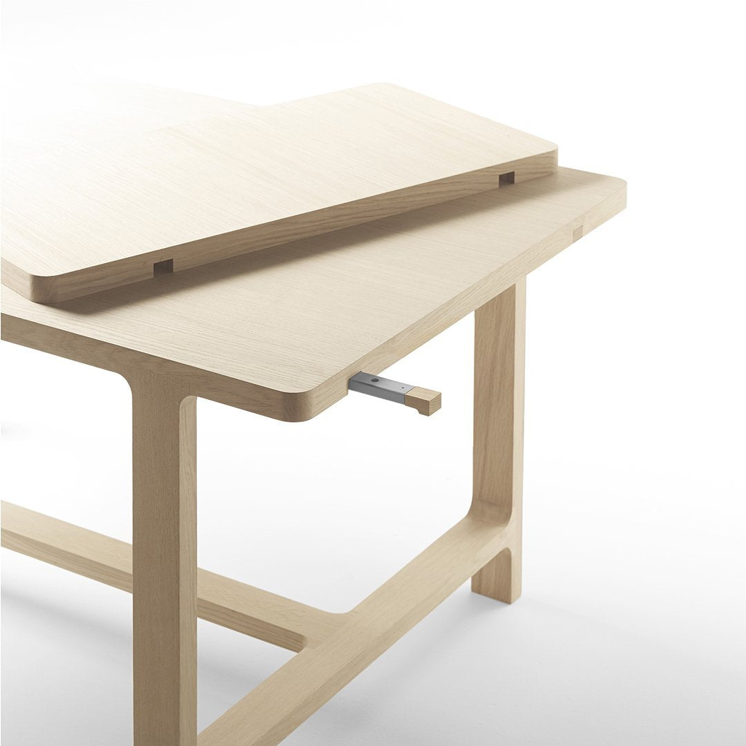 Light natural wood table with clean lines and smooth surfaces, showcasing a minimalist design.