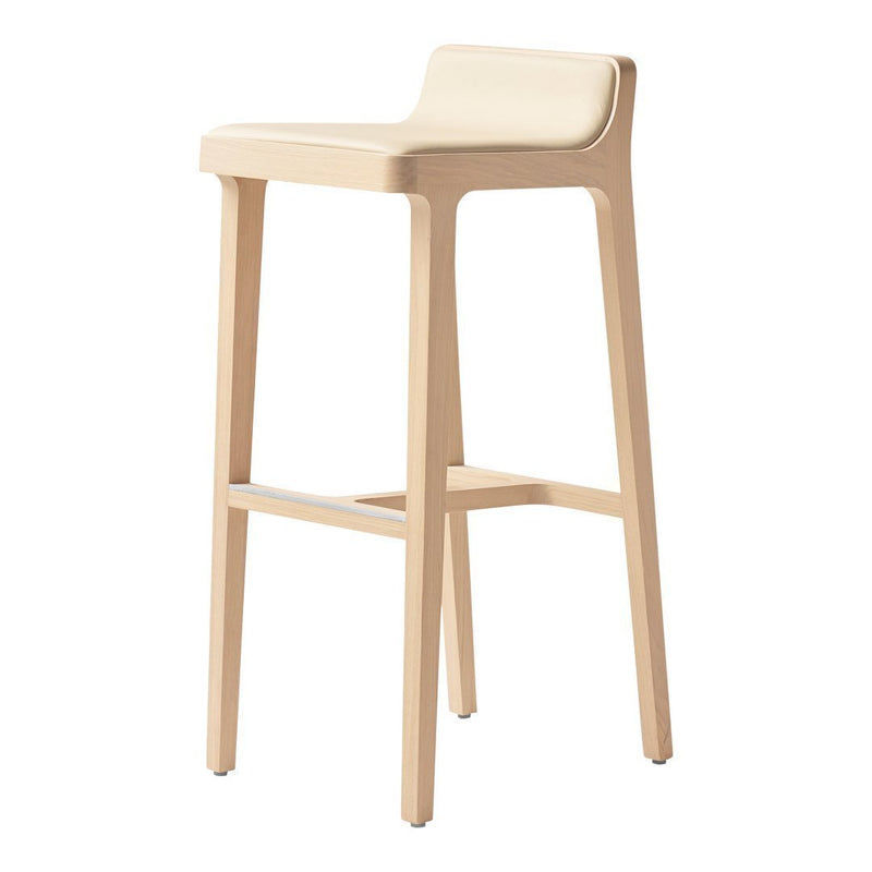 Beige bar stool with a smooth, minimalist design and natural wooden legs. Perfect for modern decor.