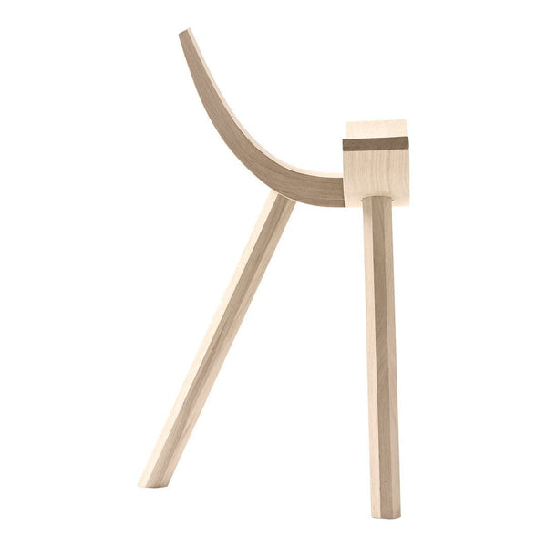 Light natural wood stool with smooth curves and minimalist design, featuring a simple, modern aesthetic.