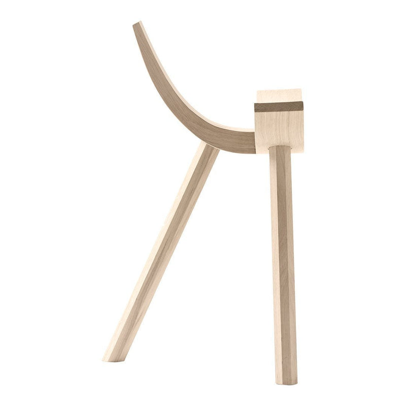 Light natural wood stool with smooth curves and minimalist design, featuring a simple, modern aesthetic.
