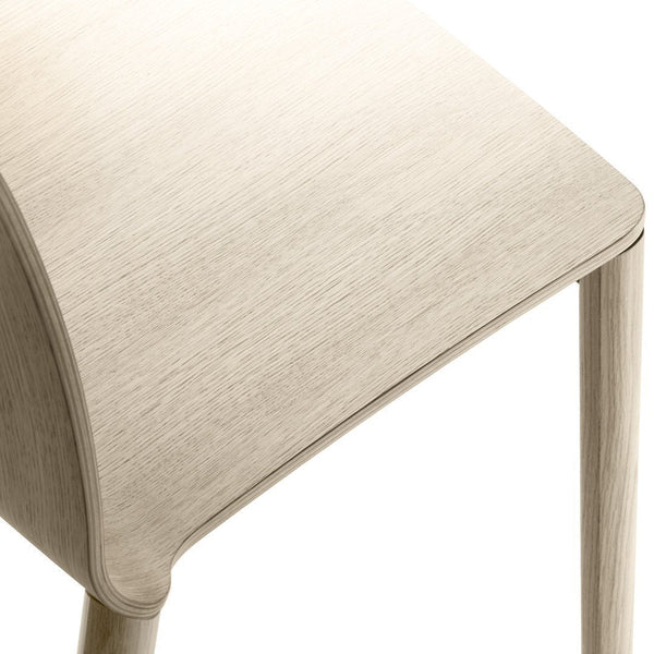 Light beige wooden chair with a smooth, sleek texture and subtle natural grain pattern. Perfect for minimalist decor.