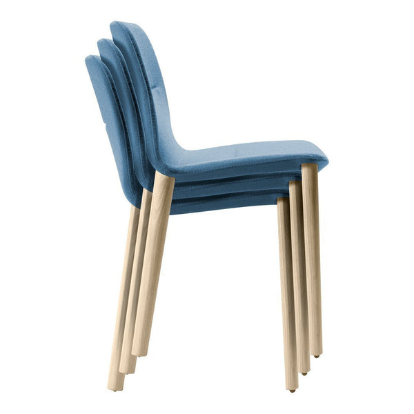 Stacked chairs in soft blue with light wooden legs, featuring a smooth, modern design. Perfect for any space.