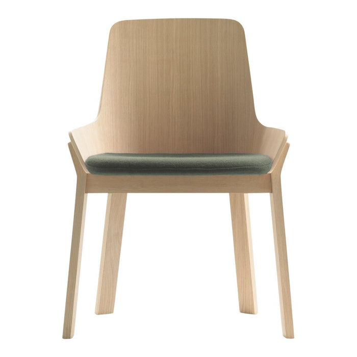 Light wood chair with a smooth finish and a soft green seat cushion, featuring a modern, minimalist design.
