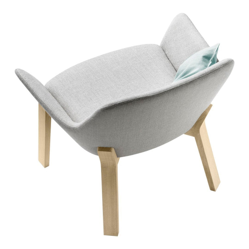Light gray upholstered chair with a smooth finish and natural wood legs, featuring a subtle blue accent pillow.