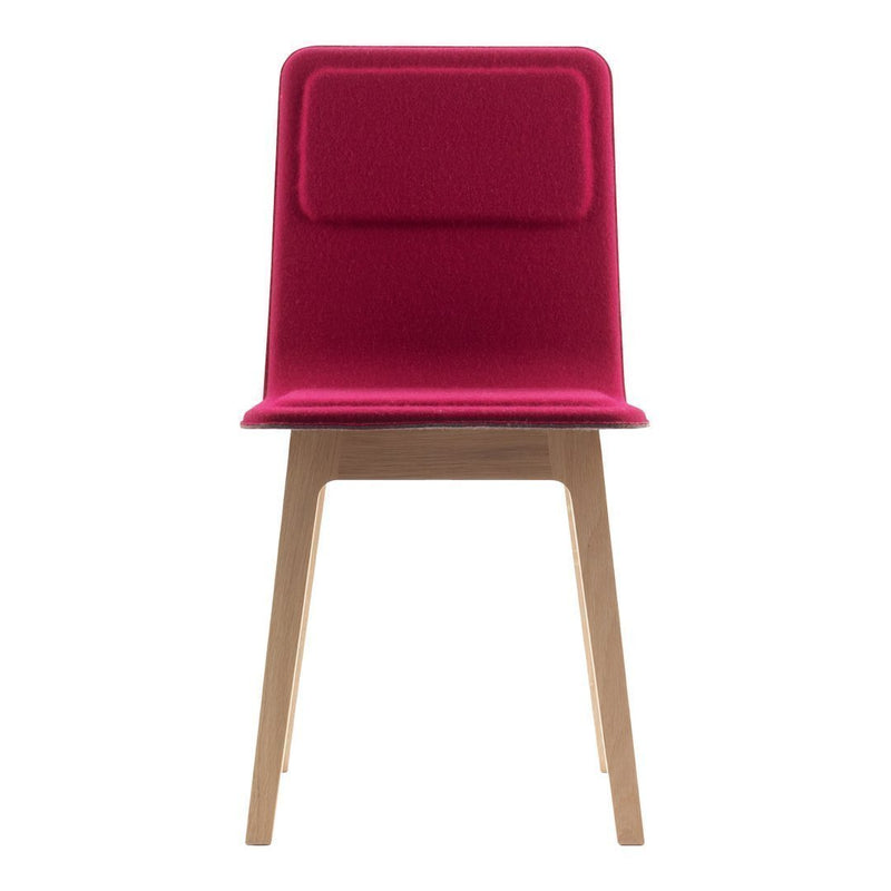 Vibrant fuchsia upholstered dining chair with a smooth wood base and simple, modern design. Ideal for contemporary spaces.