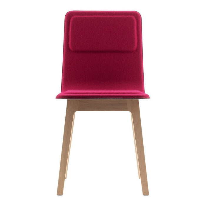 Fuchsia upholstered chair with a smooth texture and natural wood legs, featuring a minimalist design.