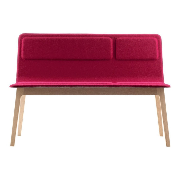 Vibrant pink two-seater sofa with a simple, modern design and two padded backrests, set on natural wood legs.