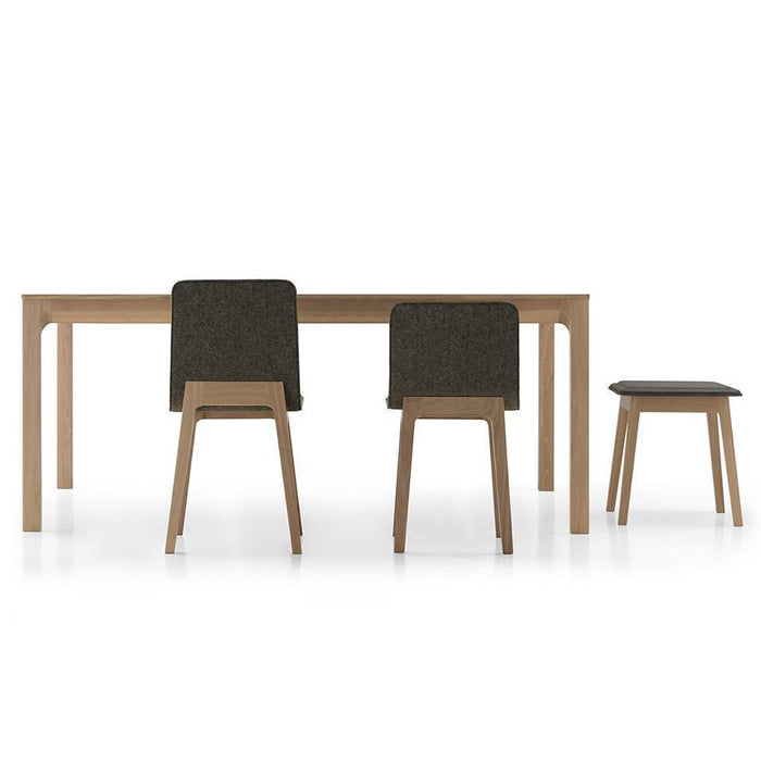 Modern wooden dining table with two brown upholstered chairs and a matching stool, featuring clean lines and neutral tones.