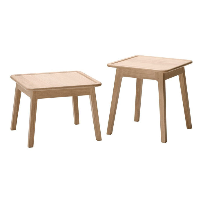 Natural light wood square side tables with smooth, minimalist design and no visible patterns.
