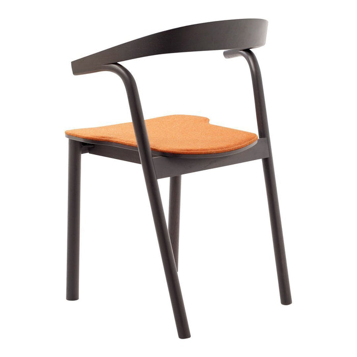 Modern chair featuring a sleek black frame and a vibrant orange seat, highlighting a minimalist design.