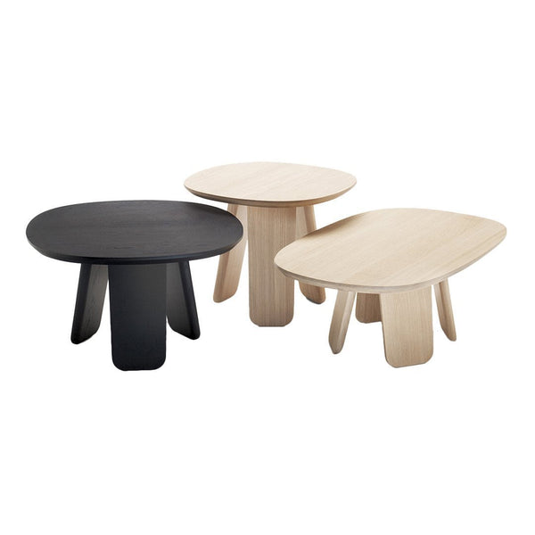 "Set of three modern tables in black and light wood finishes, featuring smooth, rounded shapes and minimalist design."