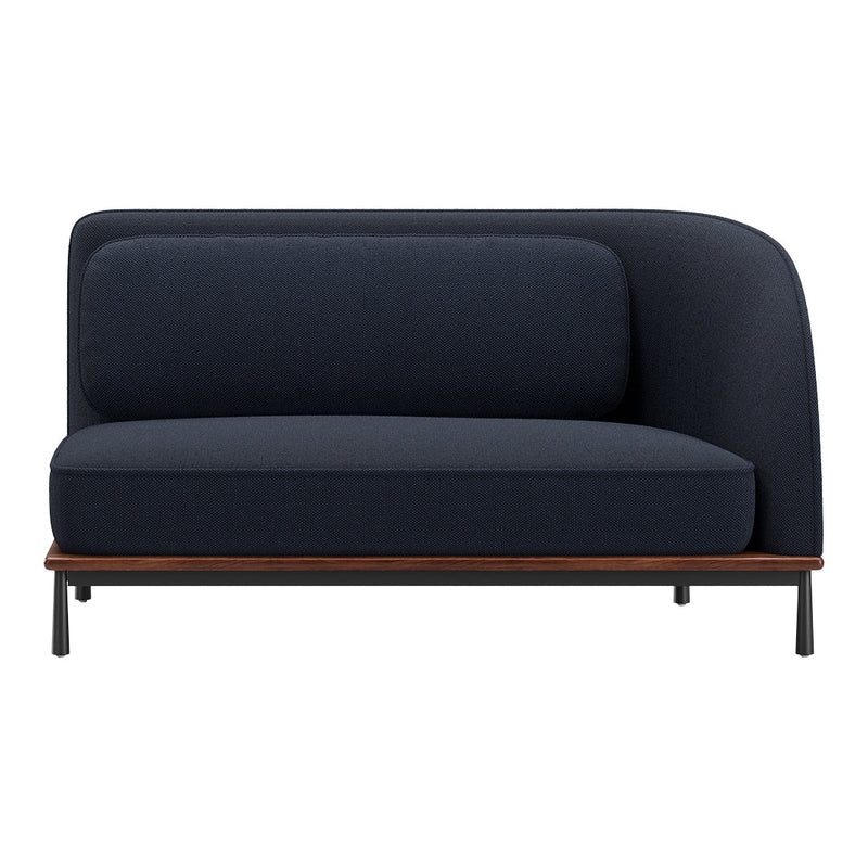 Navy blue upholstered sofa with a smooth, textured pattern and a contrasting wood and metal base.