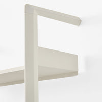 Sleek light beige shelving unit with minimalistic design and smooth matte finish. Perfect for modern interiors.