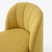 Textured yellow upholstered chair with curved design and subtle striped pattern. Perfect for modern decor.
