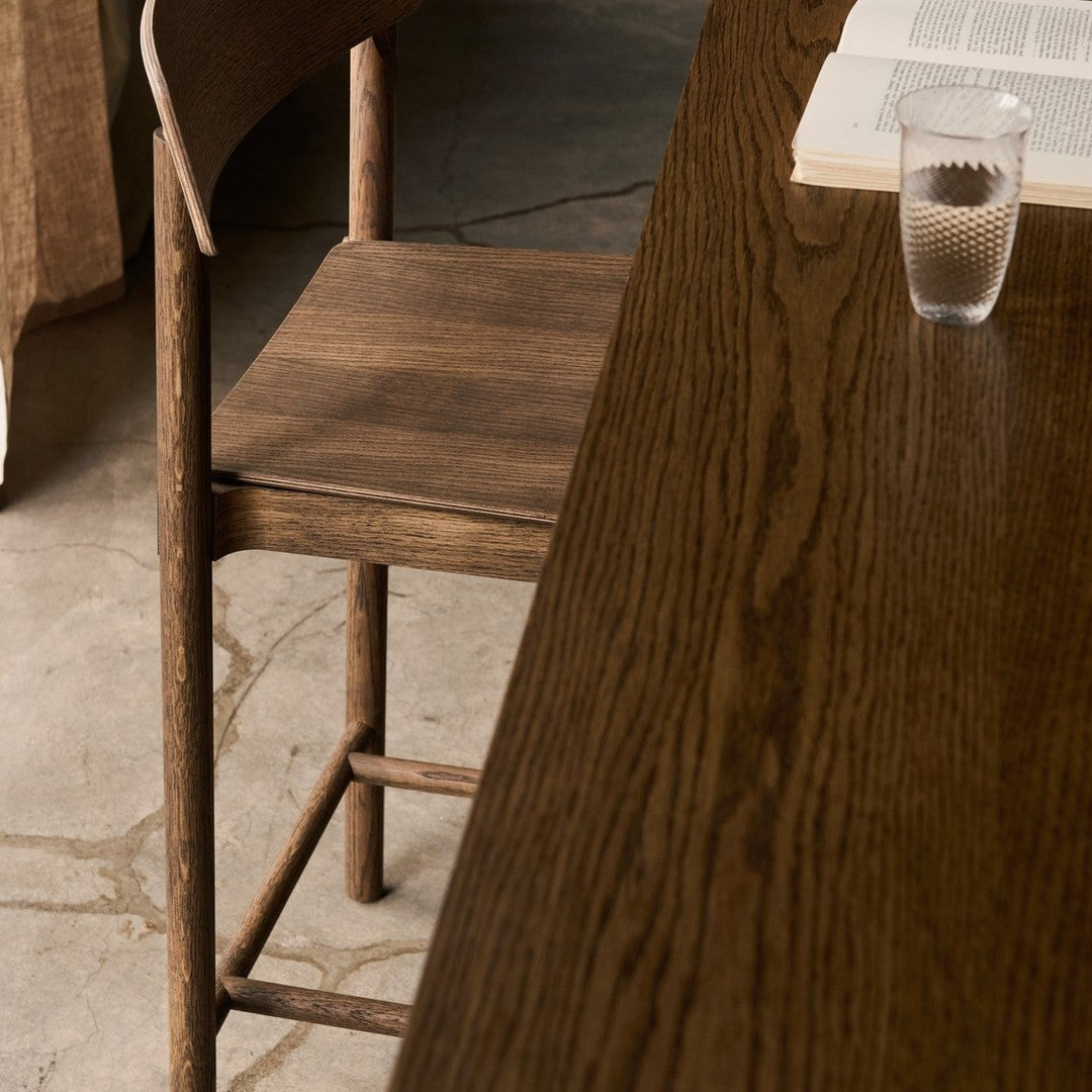 Wooden chair and table in rich brown tones, showcasing natural grain patterns and a warm, inviting aesthetic.