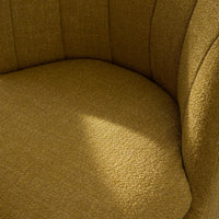 Textured mustard yellow upholstery with subtle, woven patterns for a stylish accent chair.