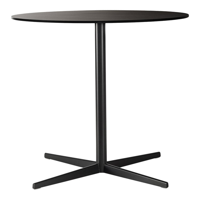 Round black table with a smooth surface and sleek black metal base design, perfect for modern decor.