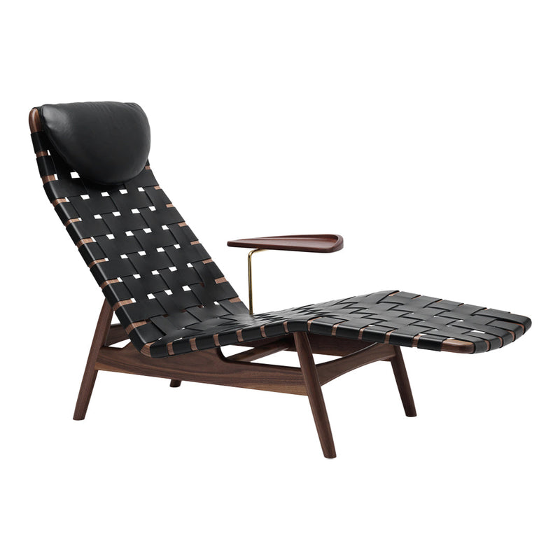 Black woven lounge chair with white and brown accents, featuring a sleek, modern design and a dark wooden frame.