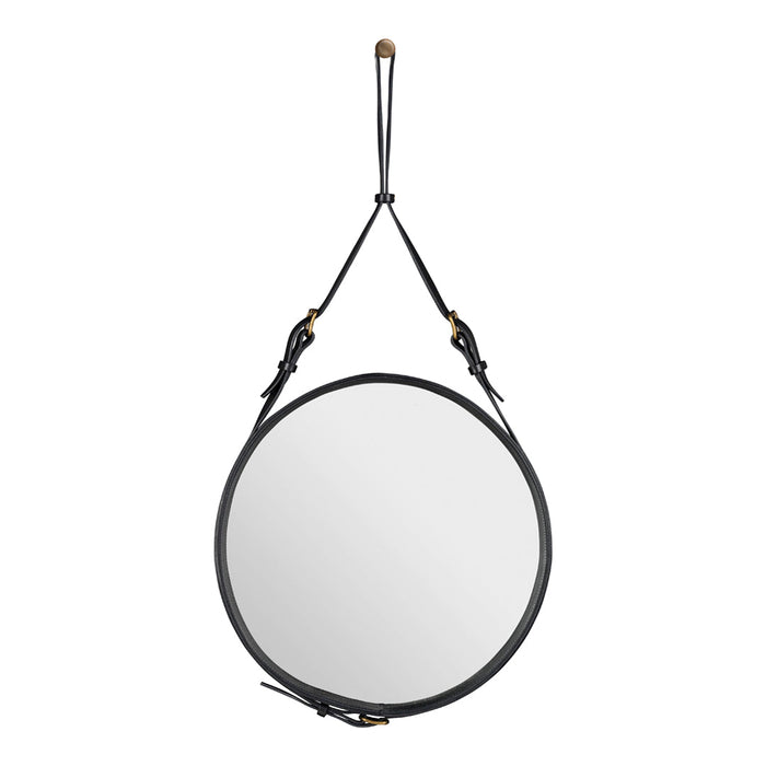 Black circular mirror with a sleek leather strap and brass accents, showcasing a minimalist design.