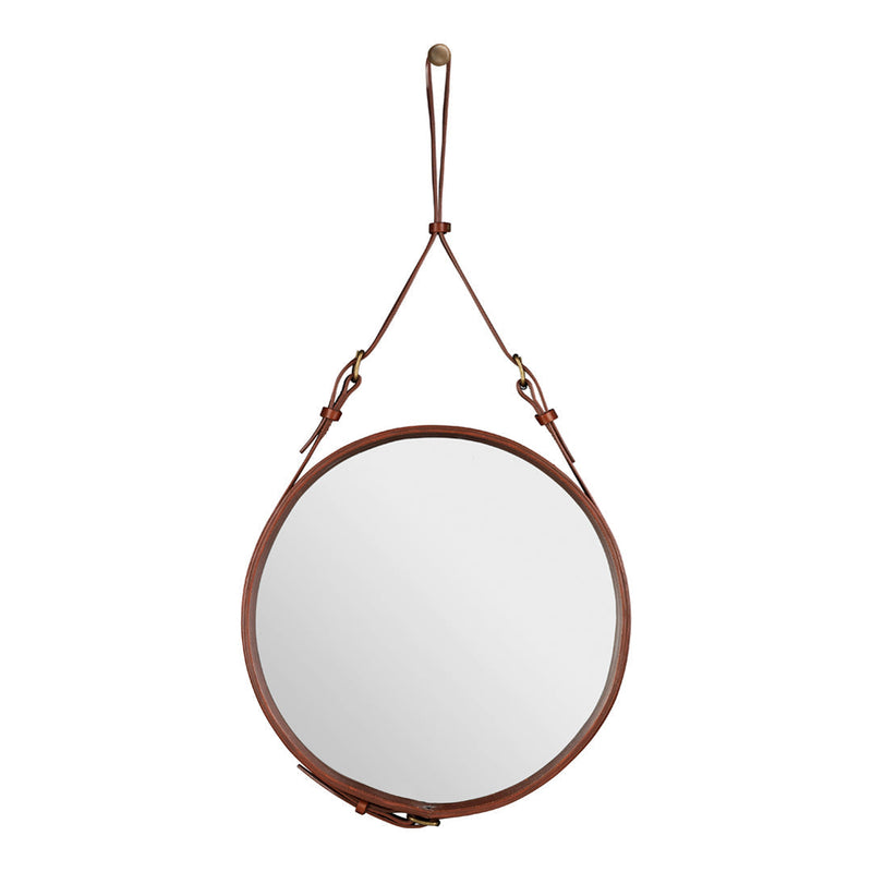 Round mirror with a sleek silver surface and a warm brown leather strap for modern decor.