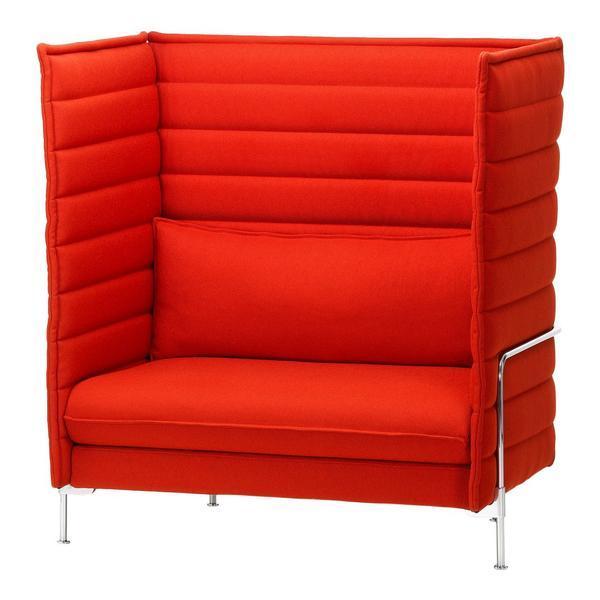 Vibrant red high-back sofa with vertical quilted pattern, featuring sleek metal legs for modern style.