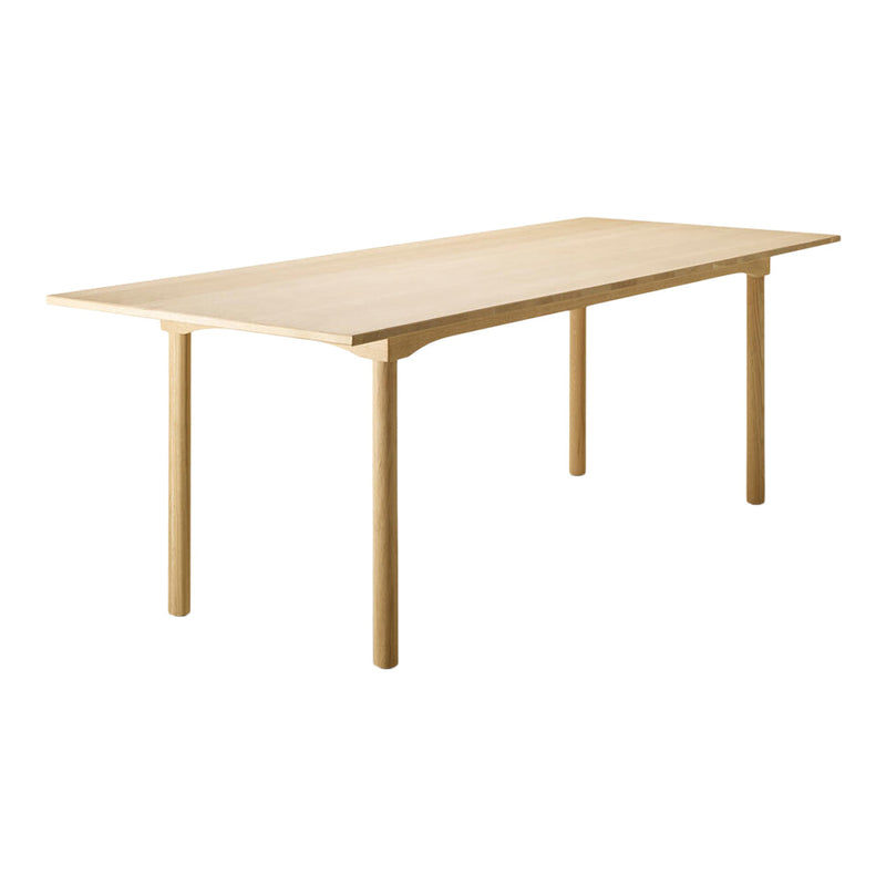 Light wood dining table with a smooth, natural finish and simple, elegant design. Perfect for modern interiors.