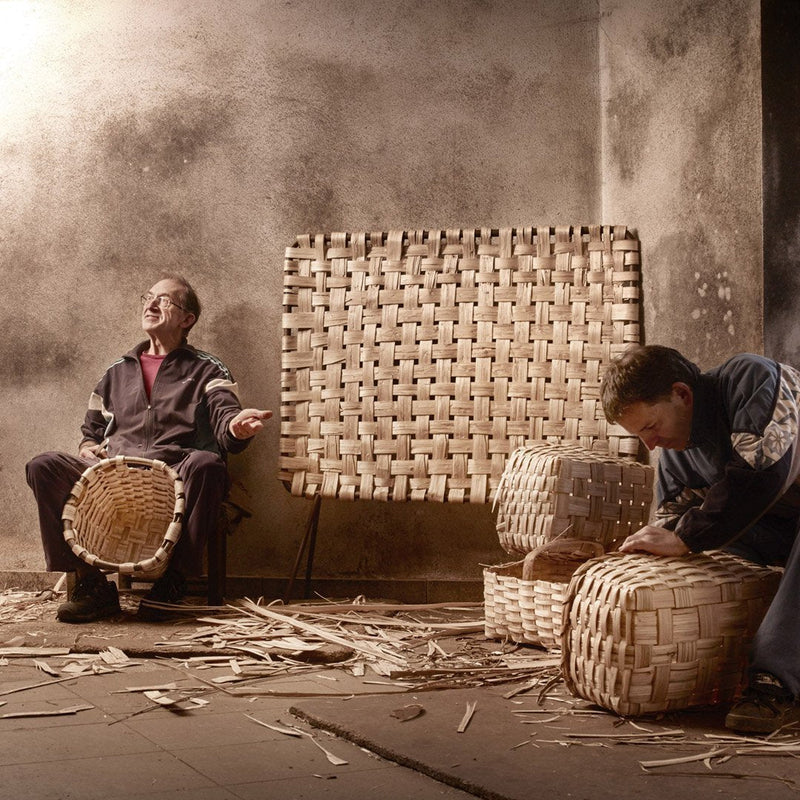 Woven natural baskets and mat in earthy tones, showcasing intricate patterns and craftsmanship.