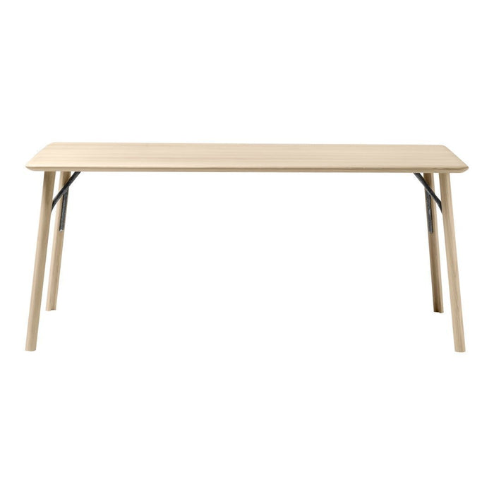 Light wood table with a smooth surface and natural finish, featuring clean lines and sturdy black metal legs.