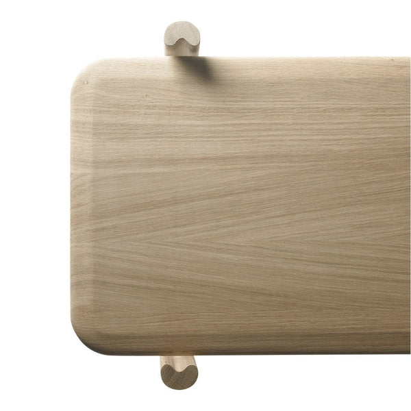 Light natural wood surface with a smooth finish and subtle grain patterns, featuring rounded corners and rounded feet.